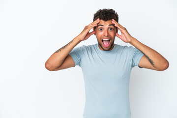 Naklejka premium Young handsome Brazilian man isolated on white background with surprise expression