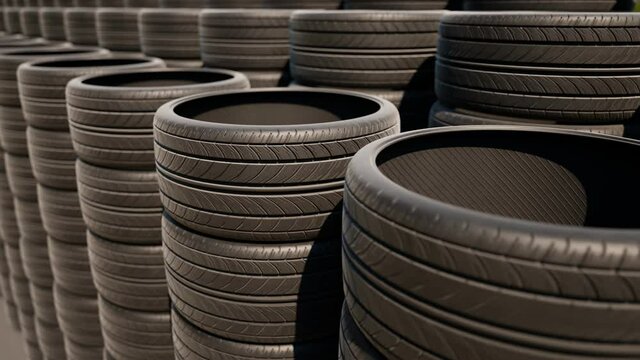 Stacks of car wheels. Black rubber tires. Tire store. Wheels changing.