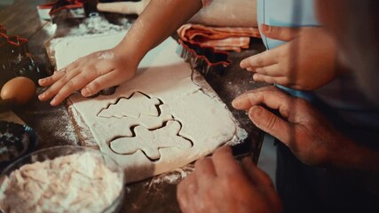 Grandfather and his cute little granddaughter prepare Christmas cookies. Close up of hands - Powered by Adobe