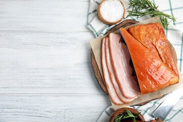 Delicious smoked bacon with rosemary and salt on white wooden table, flat lay. Space for text