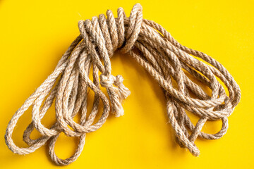 natural jute rope shibari art yellow background