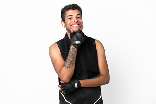 Sport brazilian man with towel isolated on white background smiling