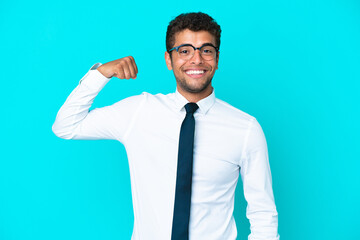 Young business Brazilian man isolated on blue background doing strong gesture