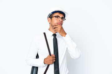 Architect brazilian man with helmet and holding blueprints and looking up