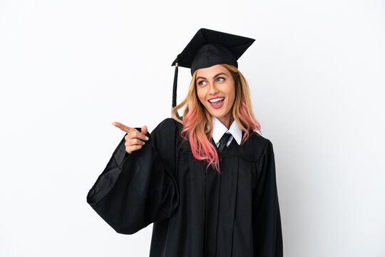 Young university graduate over isolated white background pointing finger to the side and presenting a product
