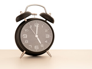 Vintage retro alarm clock, 5 o'clock.
