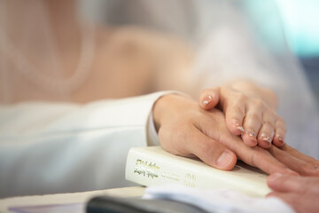 close up of a person holding a ring