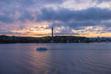 Stockholm, Sweden - Oct 14th 2021: Stockholm Baltic Sea bay a view from water with Kaknäs tower (Kaknästornet) in the background in autumn sunset