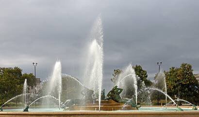 Swann Memorial Fountain (also known as Fountain of Three Rivers) 1924 on cloudy autumn day in...