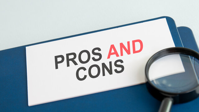 pros and cons word on paper and magnifying lens