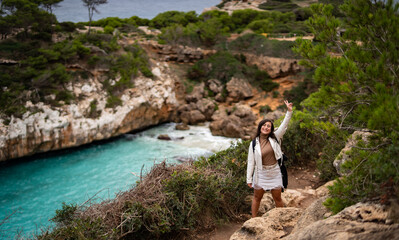Naklejka premium girl exploring and enjoining hiking on mountains in Spain