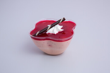 Closeup shot of a strawberry mousse on the white background