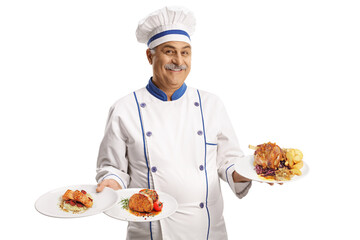 Cheerful chef smiling and holding three plates with different food