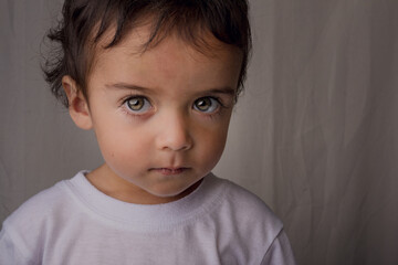 Fototapeta premium portrait of little boy with expressive eyes