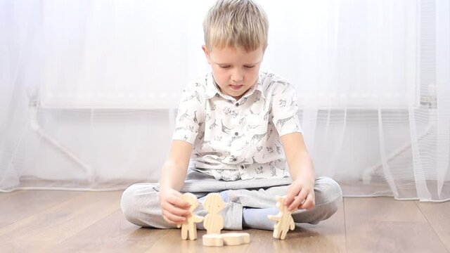 little child playing with toy blocks