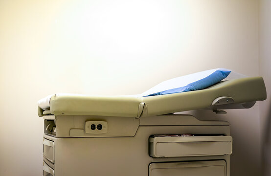 Medical Examining Room Table With Pillow. Room For Copy Text