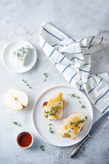 Blue cheese pear thyme toasts in a plate