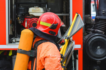 Ministry of Emergency Situations. A firefighter in special clothing prepares to extinguish the...