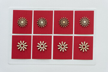 star bursts and daisies on red paper squares