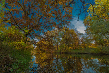 Autumn Malse river with color water and trees