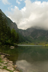 Fototapeta na wymiar Appenzell, Switzerland, June 13, 2021 Idyllic lake Seealpsee in front of the alps