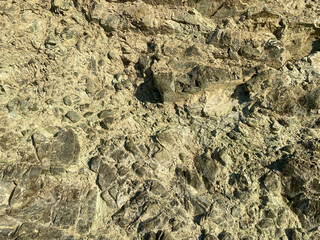 Light yellow stone textured background with cracks