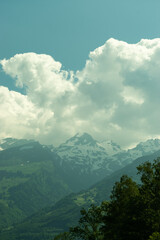 Oberriet, Switzerland, June 13, 2021 Mountain panorama with cumulus clouds