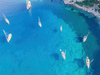 Yachts on lagoon at sunny day. Sailing boat. Yacht in the sea, aerial view from drone.