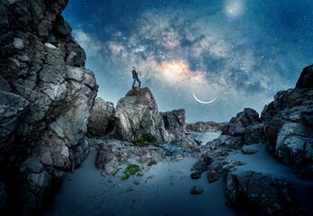 musician is playing saxophone on the top of the mountain with Milky Way background