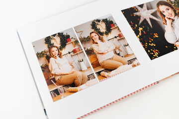 pages of photobook from photo shoot pregnancy on New Year's Day
