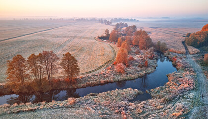 Autumn rural landscape. Frost on grass. River, field, meadow, fall color trees. Sunrise morning aerial panorama - 465857642