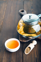 Superfood Taiwan Ku Qiao buckwheat tea in teapot and porcelain cups close-up and copy space..