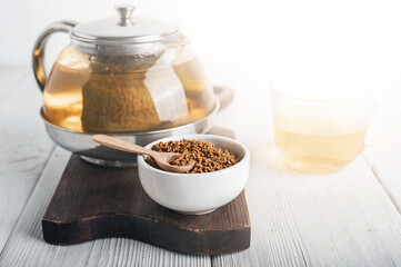 Superfood Taiwan Ku Qiao buckwheat tea in teapot and transparent cups close-up and copy space..