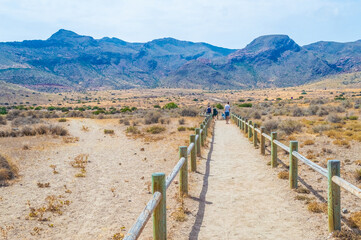 CABO DE GATA, SPAIN, 13 JULY 2016: Sandy path in Cabo de Gata toward the desert of Tabernas