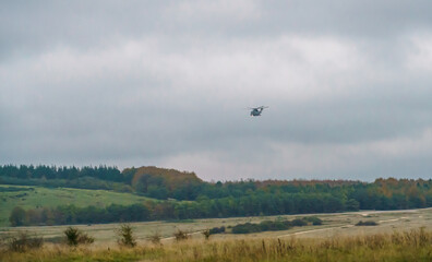 British Royal Navy AgustaWestland Merlin HM.2 AW101 helicopter on a military exercise over Wiltshire UK, low grey cloud