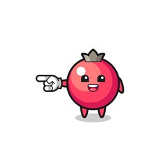 cranberry cartoon with pointing left gesture