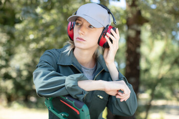 woman standing with ear protection outdoors