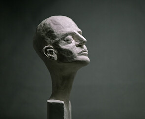 Sculpture of a bust with it's eyes closed