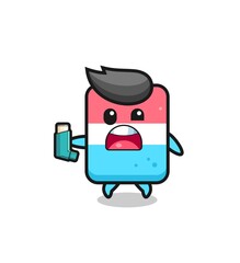 eraser mascot having asthma while holding the inhaler