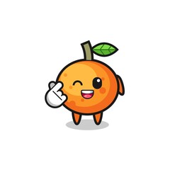 mandarin orange character doing Korean finger heart