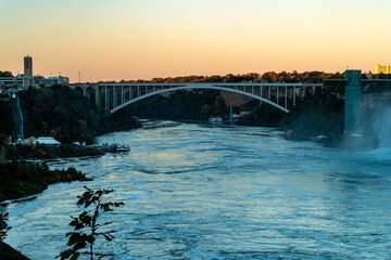 Fototapeta na wymiar Rainbow Bridge from Niagara Falls, ON to Niagara Falls, NY - View of Niagara Falls from the Ontario, Canada Side