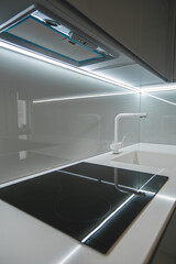 New electric stove with induction cooktop in kitchen, closeup