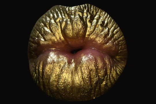 Golden kiss. Golden lipstick closeup. Lips with metal makeup. Sexy lips, Metallic lipstick close up. Glamour golden lips.