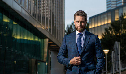 successful man in businesslike suit. manager executive outside the office. male formal fashion.