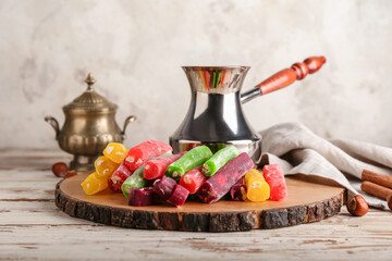 Board with tasty Turkish delight on table