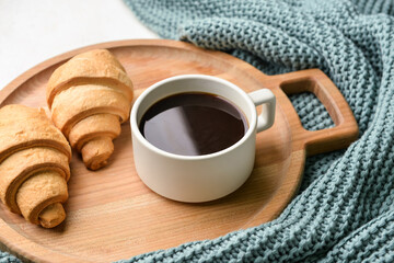 Tray with delicious breakfast and knitted blanket, closeup