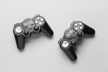 Modern joysticks on grey background © Pixel-Shot