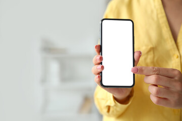 Woman pointing on blank mobile phone screen