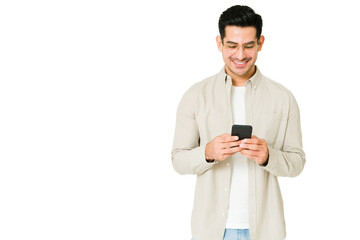 Cheerful man sending online text messages