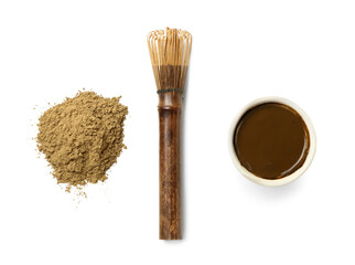 Bowl with hojicha green tea, powder and chasen on white background